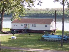 House on barge seen from Mississippi River bike path